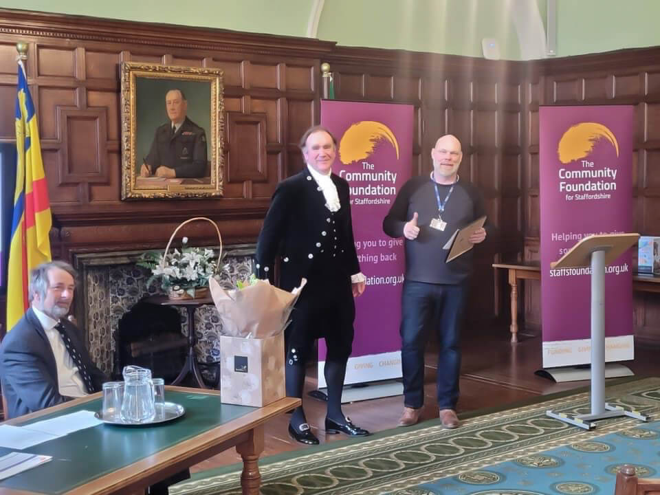 CEO of Walk accepting a certificate from the High Sheriff